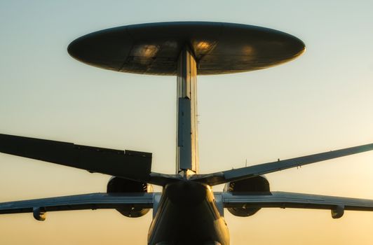 silhouette russian army reconnaissance large plane with a round antenna in isolation