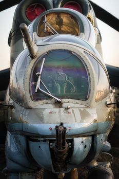 cockpit of a russian army military helicopter with a machine gun closeup
