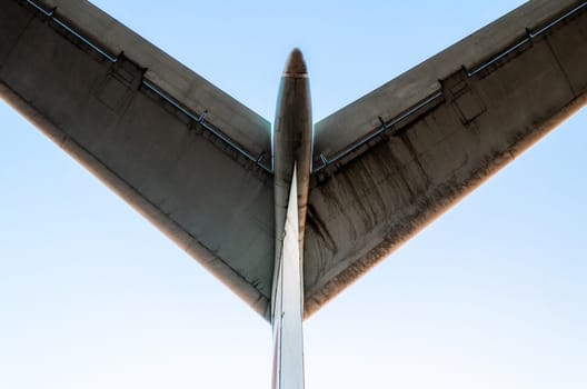 abstract background wings of a large airliner on a blue background isolated