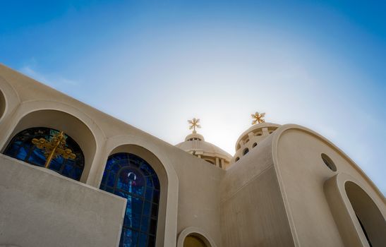 domes and crosses of a Christian church against the blue sky in Egypt in Sharm el Sheikh