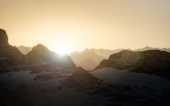 sunset with glare of the sun in the mountains in the desert in Egypt in Sharm El Sheikh