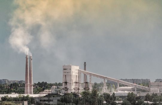 industrial landscape smoke from the chimney of the plant and smog in the sky over the city in Ukraine