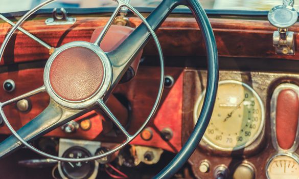 steering wheel and dashboard of an old retro car closeup