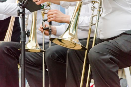 ands and trumpets of symphony orchestra musicians closeup