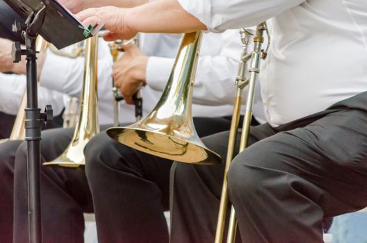 ands and trumpets of symphony orchestra musicians closeup