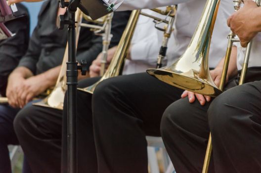 ands and trumpets of symphony orchestra musicians closeup