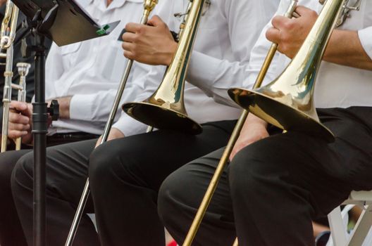 ands and trumpets of symphony orchestra musicians closeup