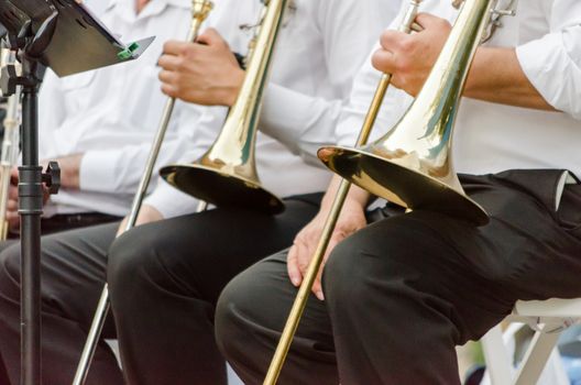 ands and trumpets of symphony orchestra musicians closeup