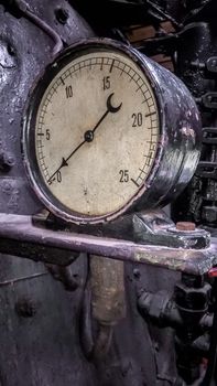 controls and valves in the cabin of an old steam locomotive