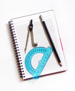 Working tools for draftsman designer. Compass, pencil and ruler with Notepad.