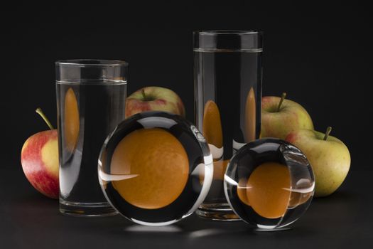 Creative surreal still life of apples and oranges
