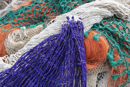 Multi colored fishing nets in a Dutch port in the North of the Netherlands
