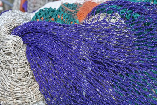 Multi colored fishing nets in a Dutch port in the North of the Netherlands
