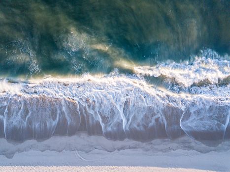 Drone picture of the waves hitting the beach on the Swahili Coast, Tanzania.