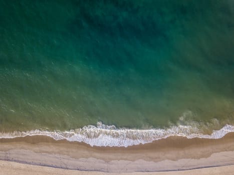 Drone picture of the waves hitting the beach on the Swahili Coast, Tanzania.