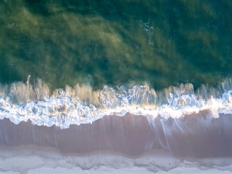 Drone picture of the waves hitting the beach on the Swahili Coast, Tanzania.