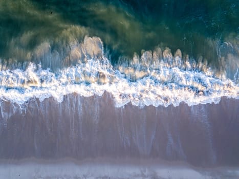 Drone picture of the waves hitting the beach on the Swahili Coast, Tanzania.