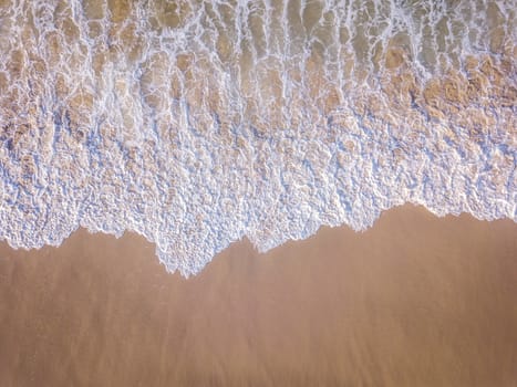 Drone picture of the waves hitting the beach on the Swahili Coast, Tanzania.