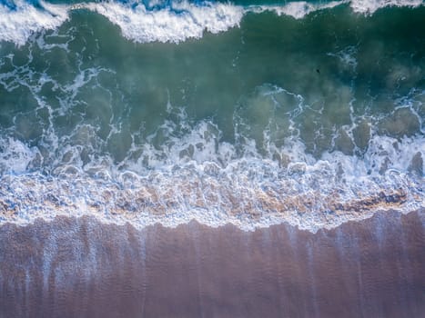 Drone picture of the waves hitting the beach on the Swahili Coast, Tanzania.