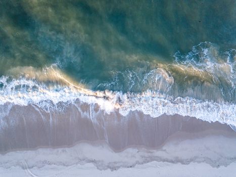 Drone picture of the waves hitting the beach on the Swahili Coast, Tanzania.