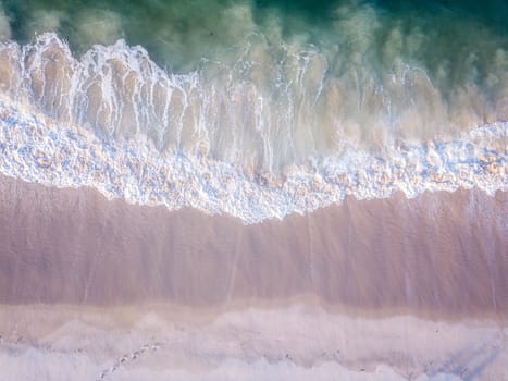 Drone picture of the waves hitting the beach on the Swahili Coast, Tanzania.