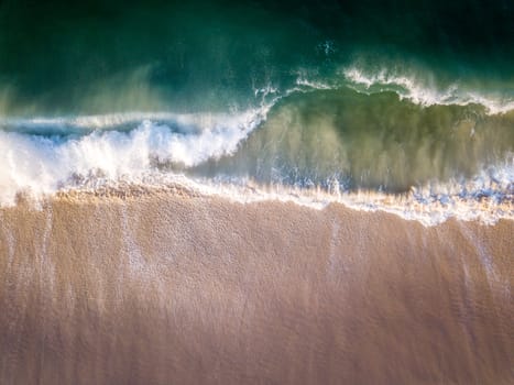 Drone picture of the waves hitting the beach on the Swahili Coast, Tanzania.