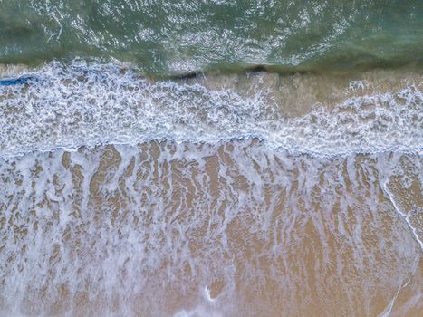 Drone picture of the waves hitting the beach on the Swahili Coast, Tanzania.