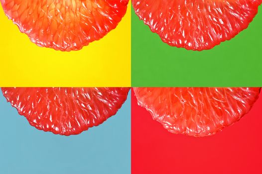 Peeled Slice Of Juicy Grapefruit on Yellow,Green, Blue and Red Background