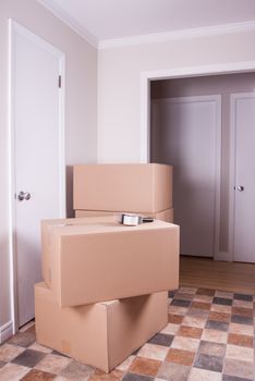 Stack of big moving cardboard box in an empty house