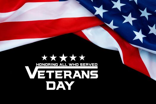 Happy Veterans Day with American flags on dark background.