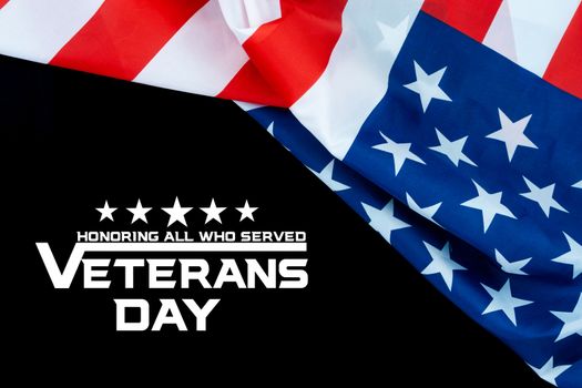 Happy Veterans Day with American flags on dark background.
