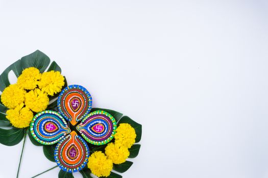 Indian festival Diwali, Diya oil lamps lit on colorful rangoli. Hindu traditional. Happy Deepavali. Copy space for text.