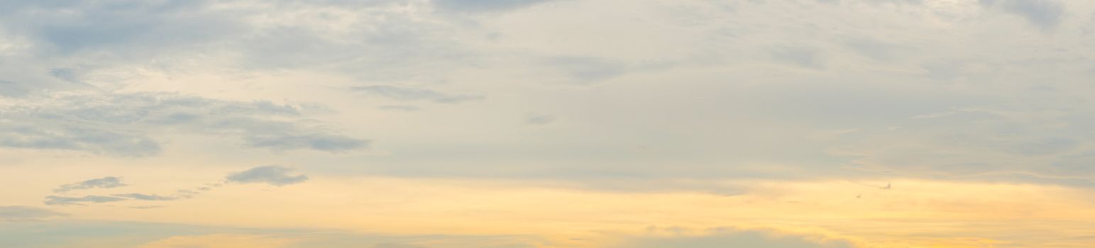 Panorama clear warm sky with white cloud background in the sunset time. warm light sky background.