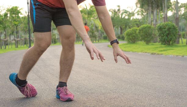 Sport man ankle sprain while running at the park.  Healthcare and sport concept.