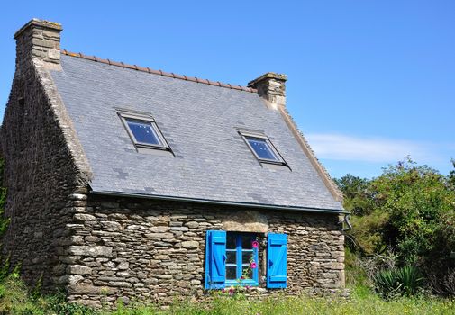 stone house on the island of Groix in summer, France. countryside, sea and calm