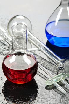 Chemical glassware on a glass studio background