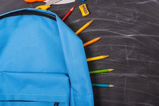 Back to school shopping backpack, The Accessories in student blue bag on blackboard background and have chalkboard also