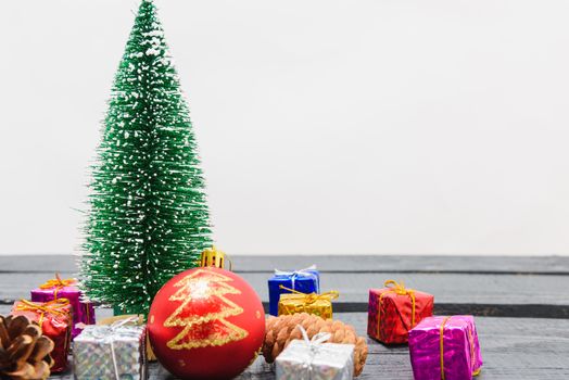 Christmas composition decorations, minimal green fir tree branches with snow and gift boxs on white background. Merry Christmas concept. Copy space for text
