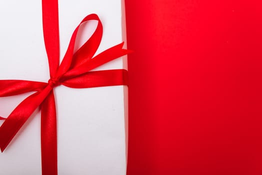 Happy New Year and Christmas 2020 or valentine day, top view Xmas white gift box on red background with copy space for your text