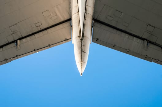 fragment of airplane wings on a background of blue sky isolated background