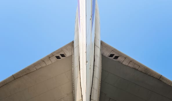 fragment of airplane wings on a background of blue sky isolated background