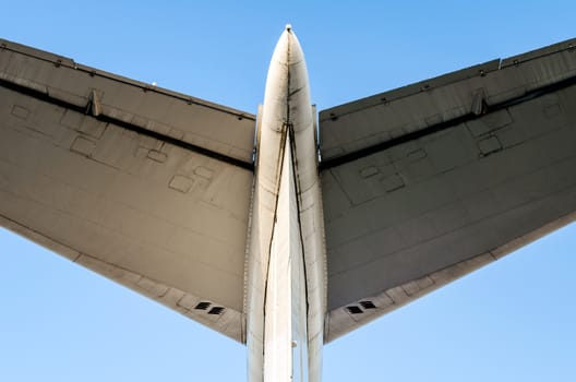 fragment of airplane wings on a background of blue sky isolated background