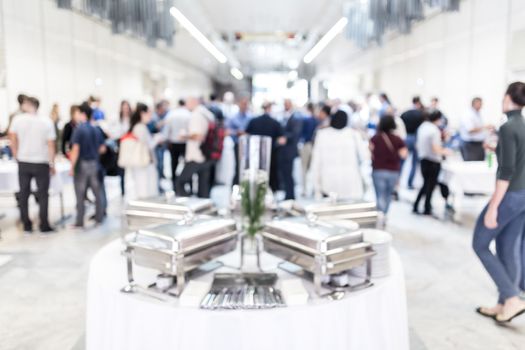 Blured image of businesspeople at coffee break at conference meeting. Business and entrepreneurship.