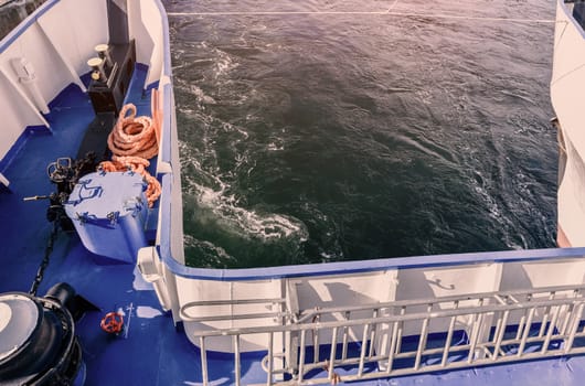 The nose of the ship, the bow of the floating ship, the cruise liner, the yacht, the boat on the background of the blue salt sea, the ocean on the tropical sea warm resort,