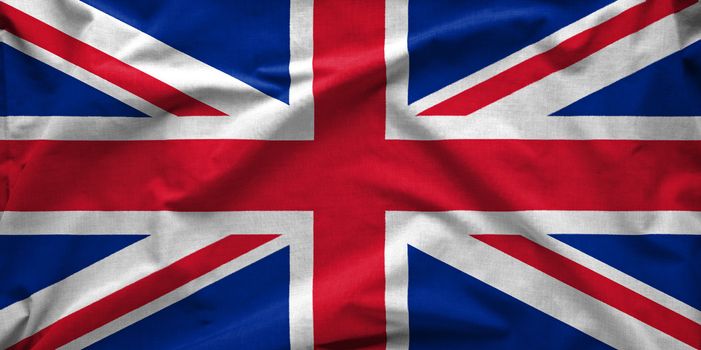 Union Jack wide silk flag of The United Kingdom of Great Britain and Northern Ireland blowing in the wind in full frame background concept