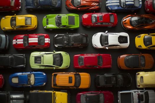 Traffic jam of toy cars, many cars standing in a line urban problems concept