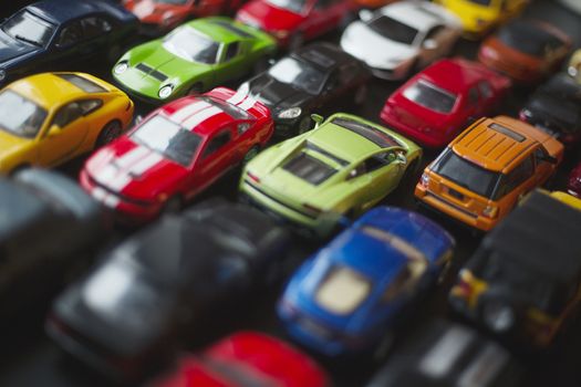 Traffic jam of toy cars, many cars standing in a line urban problems concept