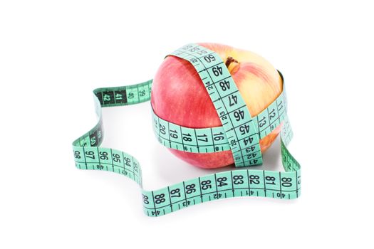 Diet, healthy eating, weight loss concept. Measuring tape wrapped around an apple, isolated on white background. Symbol of vitamin diet, slim shape and healthy food.
