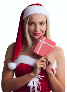 Happy excited young woman in santa dress and hat with gift box isolated on white background