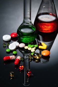 Glass chemical tableware on a glass background